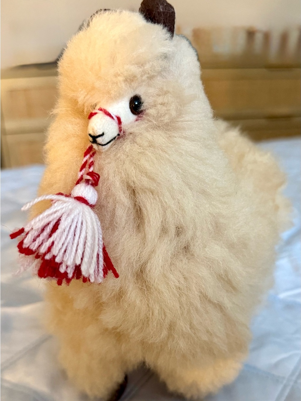 Plush Beige Alpaca with Red-White Tassel